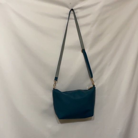 Bebe Los Angeles teal purse. Measures 14”x9”x4” with a 48” long and adjustable - Picture 4 of 6